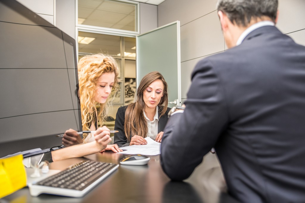 two women talking to a lawyer