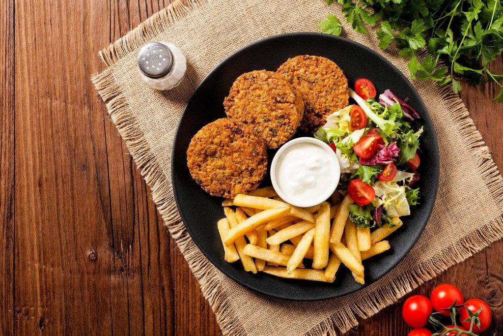 Falafel and chips served on a plate