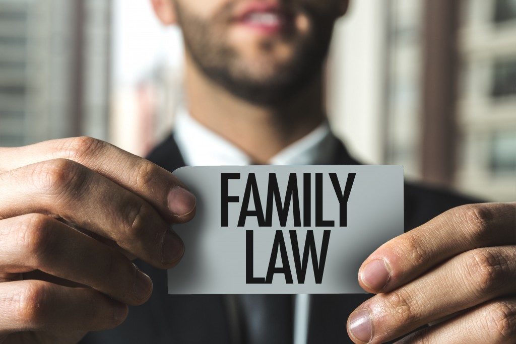 Man holding "family law" sign