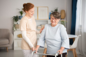 nurse helping an elderly