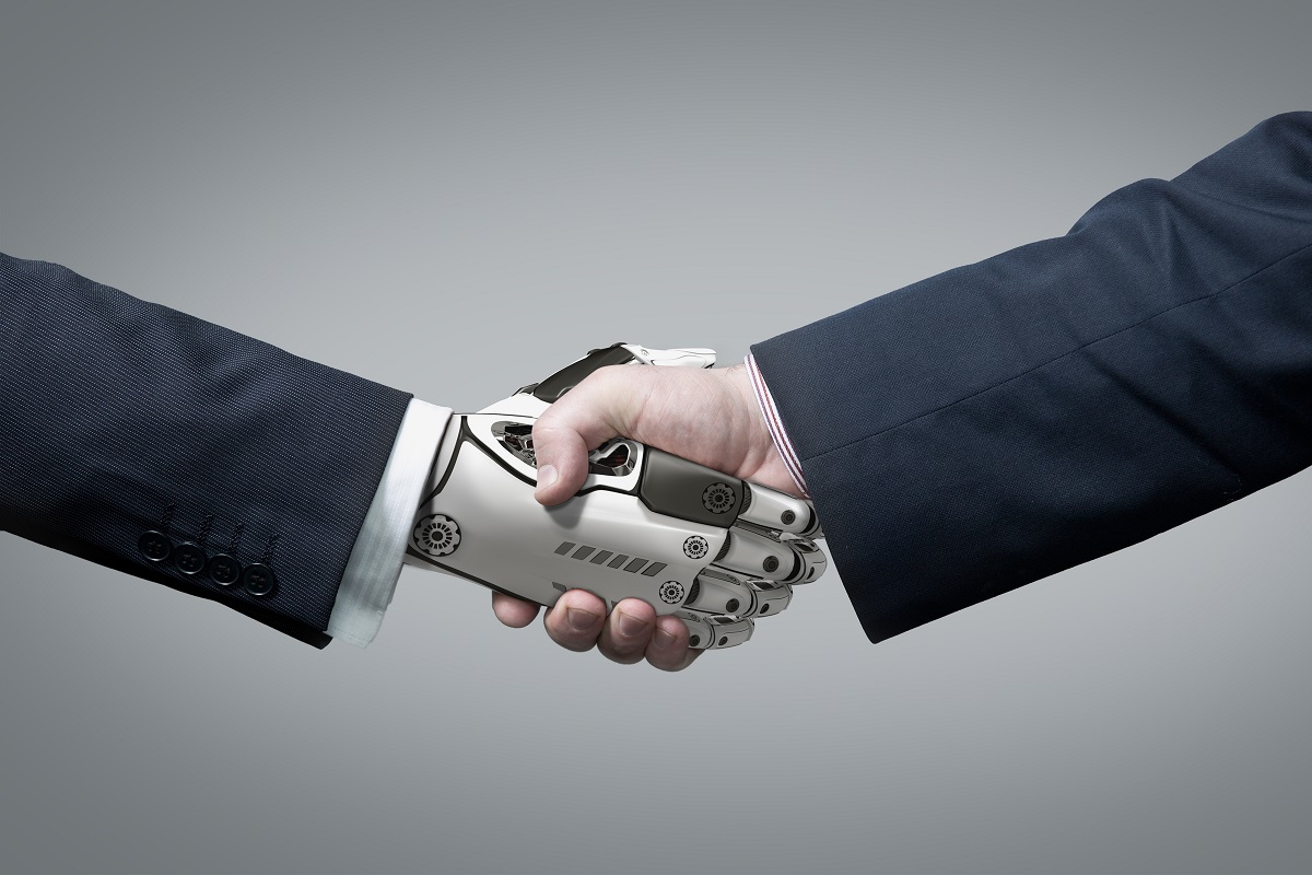 shaking hands of a robot and human
